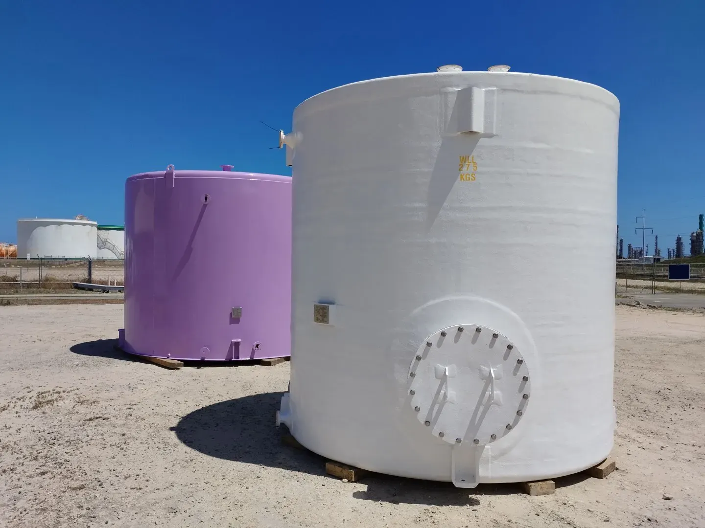 Vertical FRP chemical storage tanks on site at Kwinana
