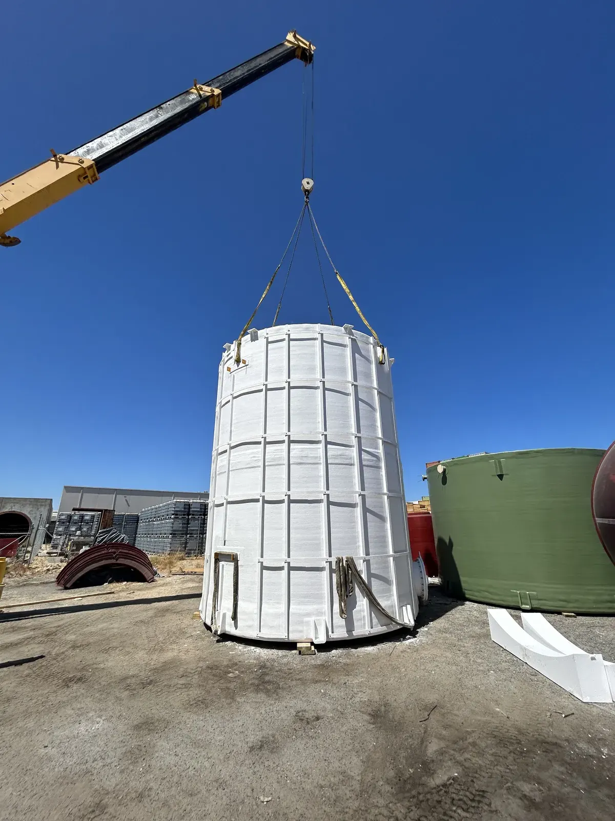 FRP tank with external ribs being lifted for Ixom